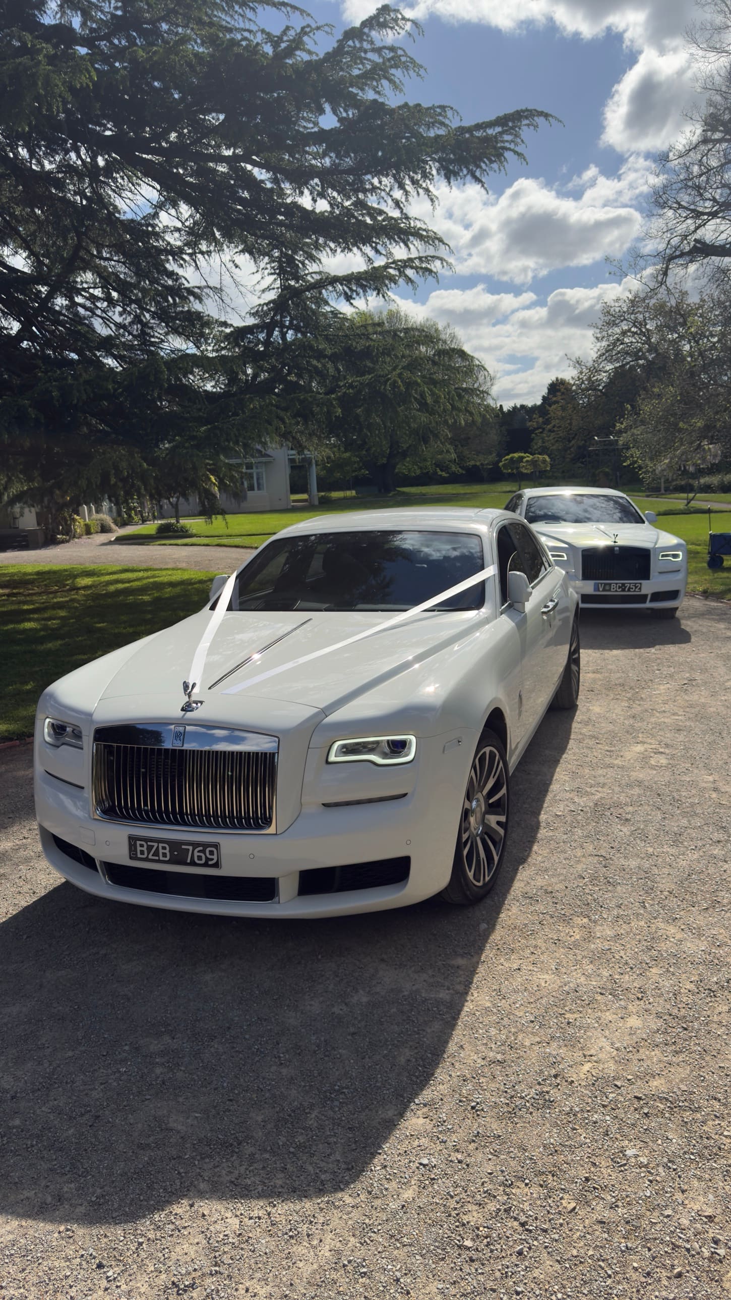Rolls-Royce Ghost and Cullinan, ribbons on for a wedding